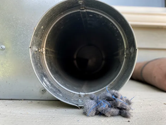Valinda Dryer Vent Cleaning technician using specialized equipment to clear severe dryer vent blockage in Valinda